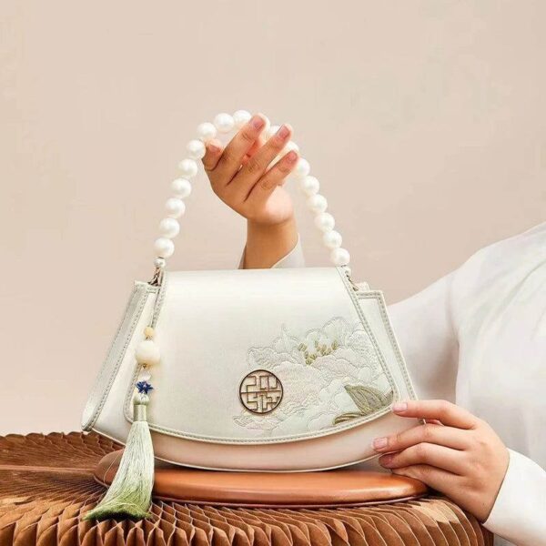 Embroidery_Leather_Vintage_White_Lotus_Handbag_with_Pendant_-_SinoCultural-2476532.jpg