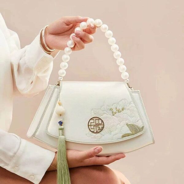 Embroidery_Leather_Vintage_White_Lotus_Handbag_with_Pendant_-_SinoCultural-2476538.jpg