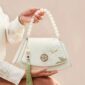 Embroidery_Leather_Vintage_White_Lotus_Handbag_with_Pendant_-_SinoCultural-2476538.jpg